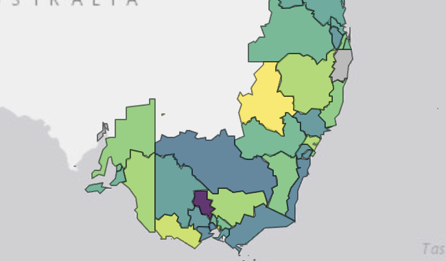 A very light grey map of south-east coast of Australia is shown, with the surrounding ocean a darker gray. The map of Australia has several coloured shapes indicaitng employment regions in shades of green, yellow, and purple.