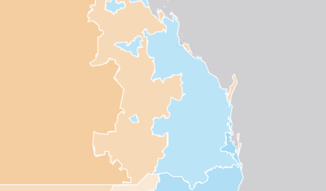 A map of the coast of Queensland with dark grey representing the ocean. Blue and purple areas on the land represent zones of NAPLAN achievement.